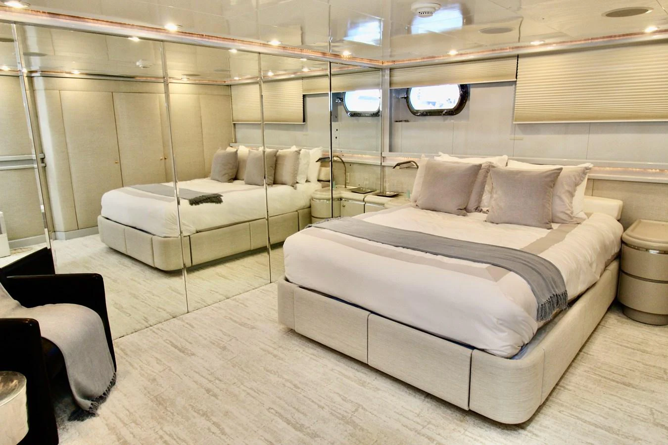 a room with a bed and a couch aboard MAVERICK Yacht for Sale