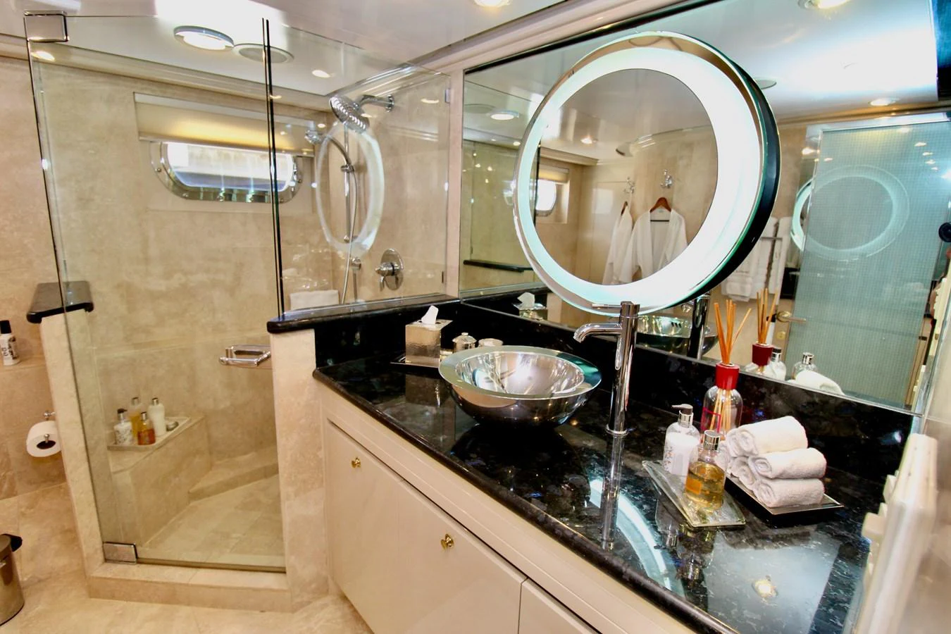 a bathroom with a large mirror aboard MAVERICK Yacht for Sale