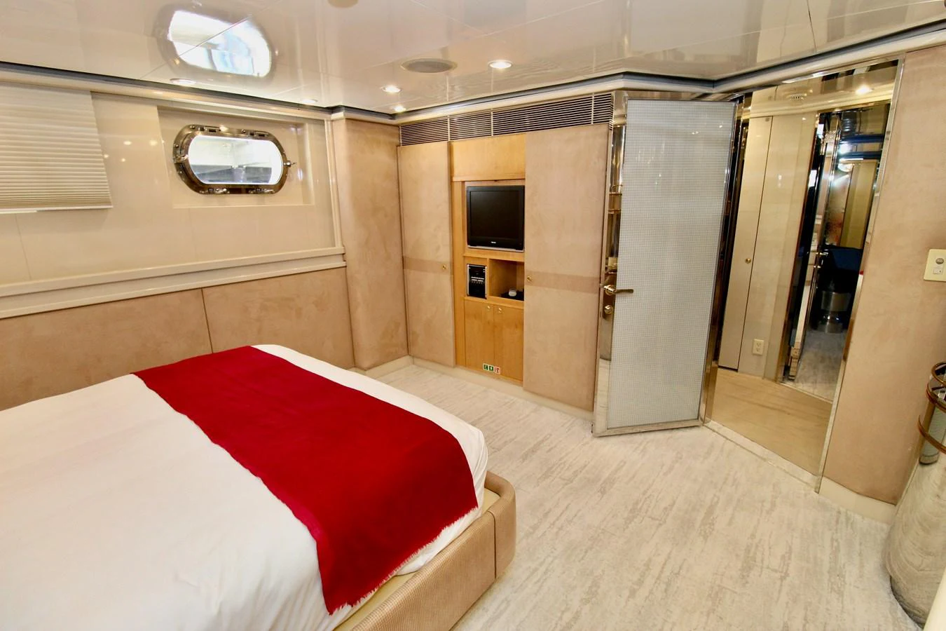 a room with a bed and a tv aboard MAVERICK Yacht for Sale