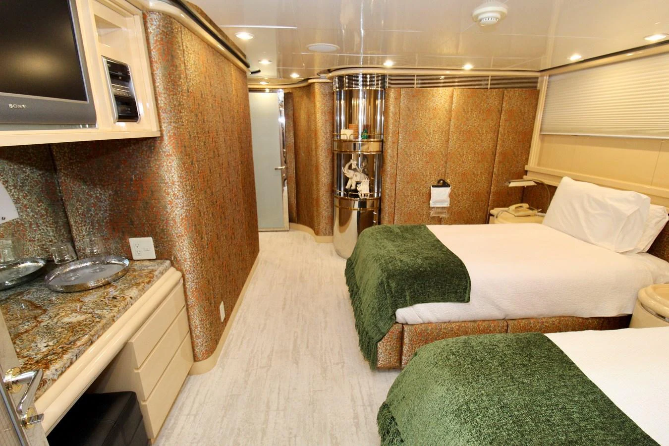a room with a couple of beds aboard MAVERICK Yacht for Sale