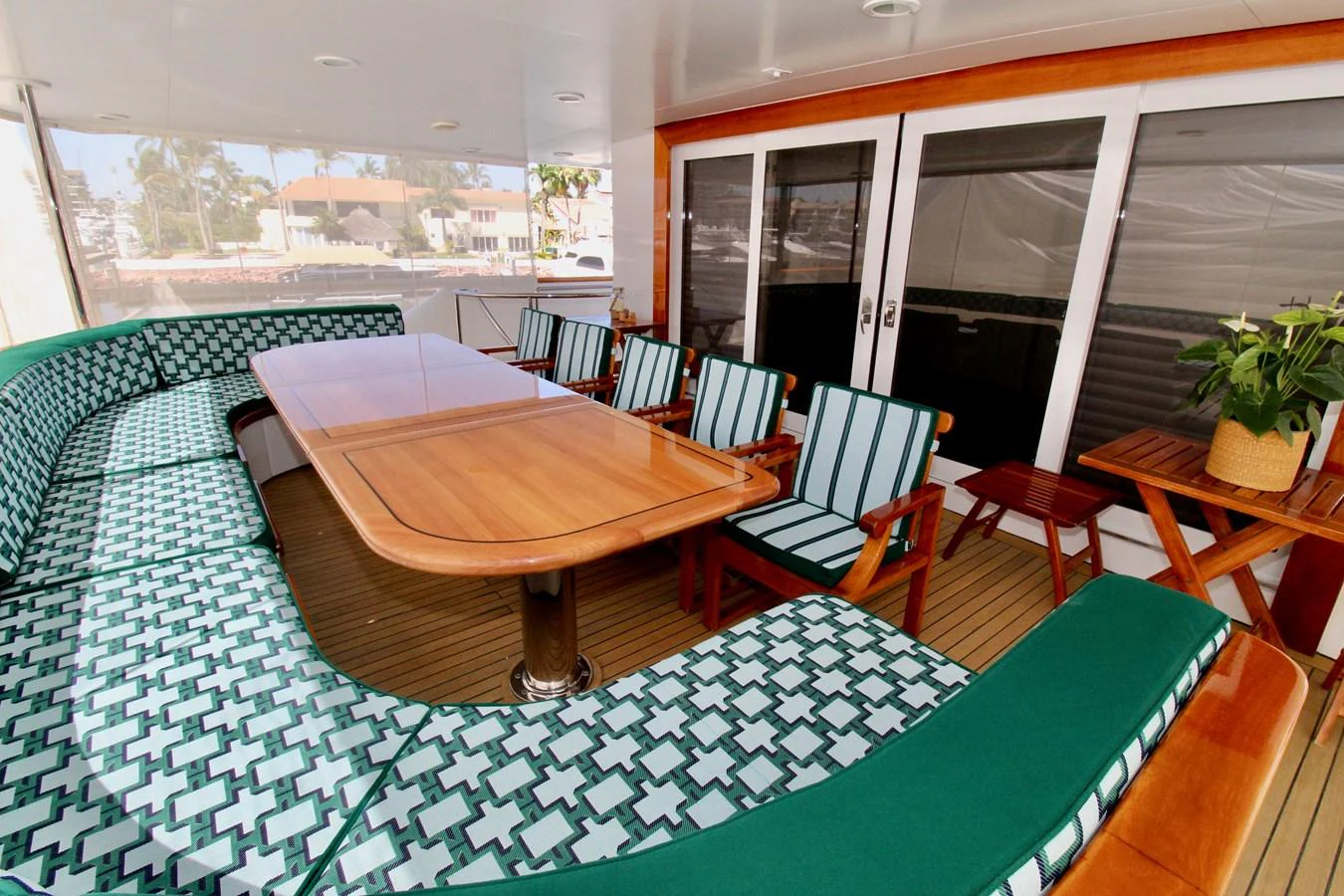 a table and chairs on a balcony aboard MAVERICK Yacht for Sale