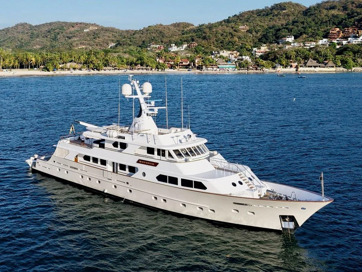 a large white yacht in the water aboard MAVERICK Yacht for Sale