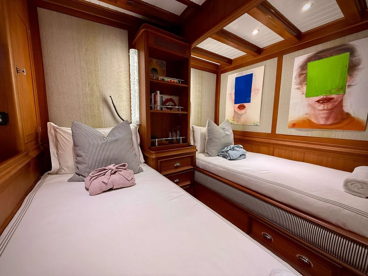 a room with two beds aboard NAMUUN Yacht for Sale
