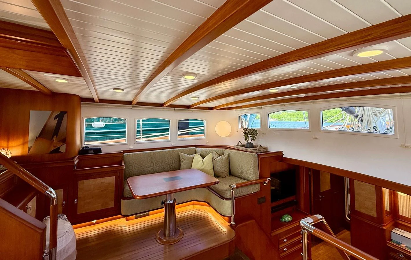 a living room with a couch and a coffee table aboard NAMUUN Yacht for Sale