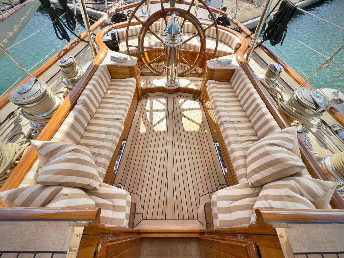 a large boat with wooden seats aboard NAMUUN Yacht for Sale