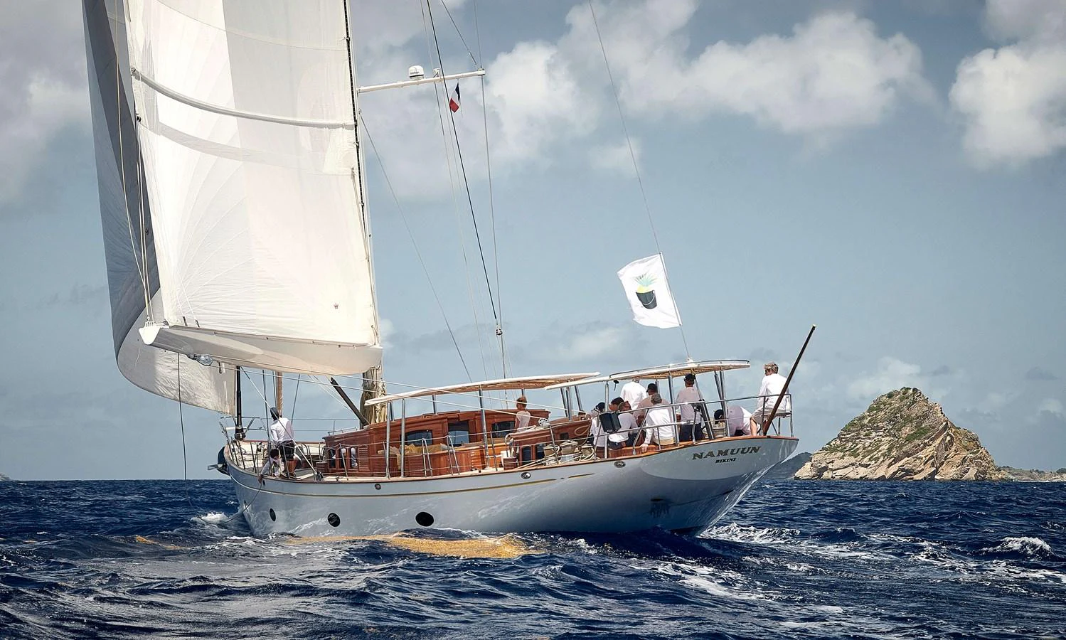 a group of people on a sailboat aboard NAMUUN Yacht for Sale