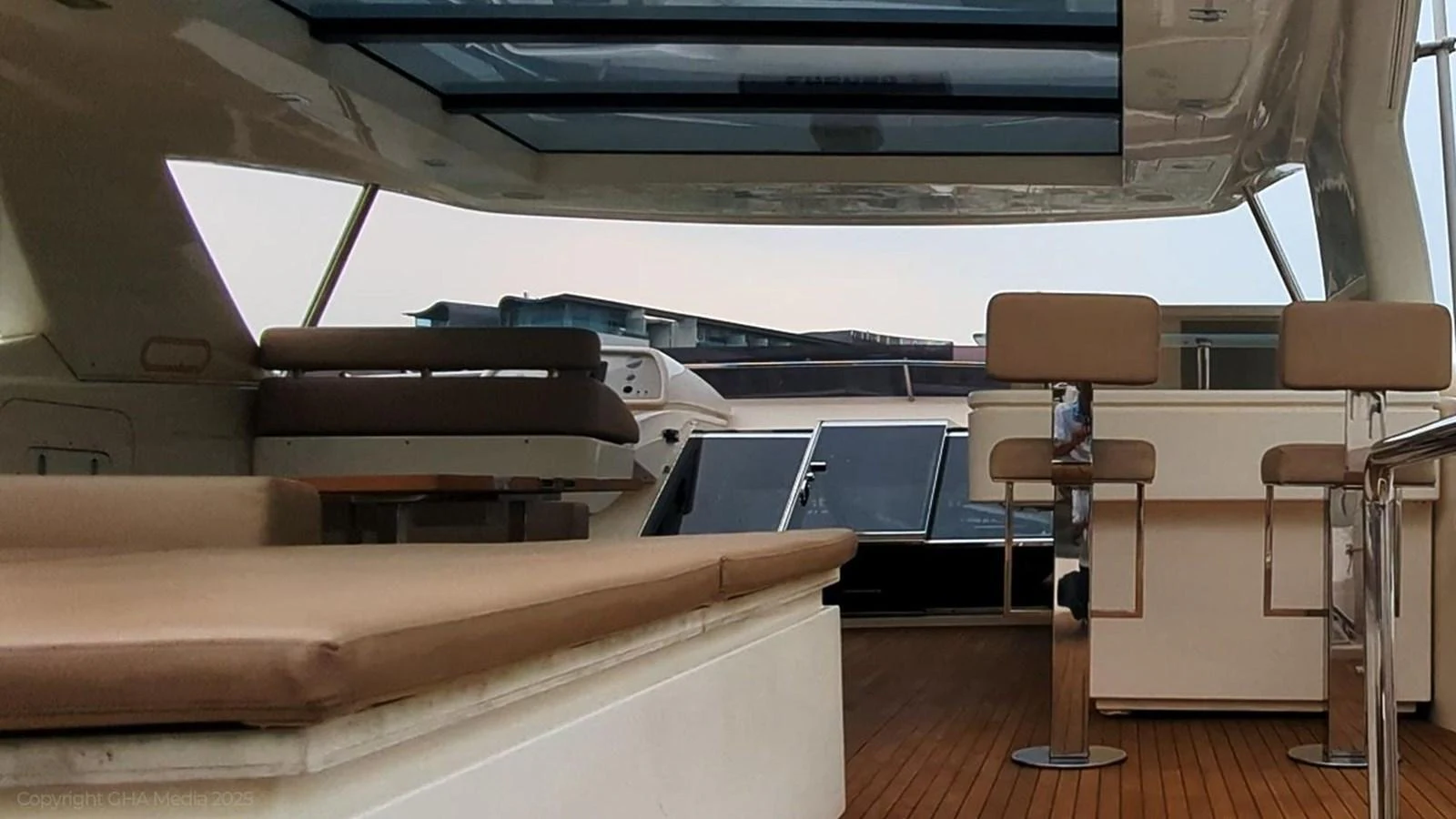 a room with a bench and chairs aboard OXYGEN Yacht for Sale