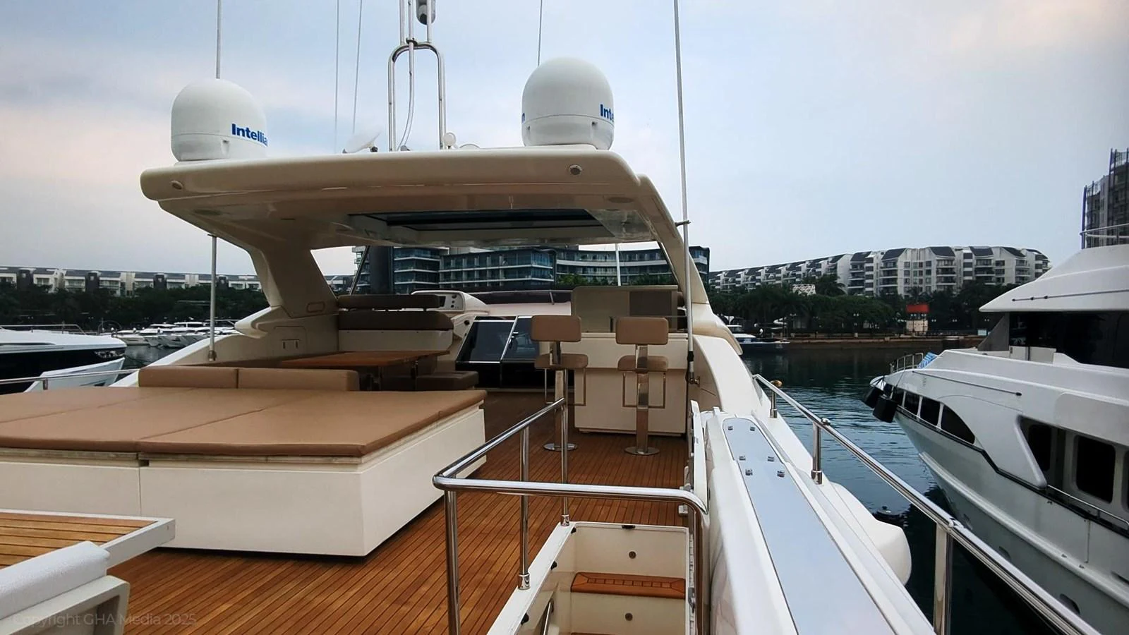 a deck with a large white boat and a large white building with a dome on top aboard OXYGEN Yacht for Sale