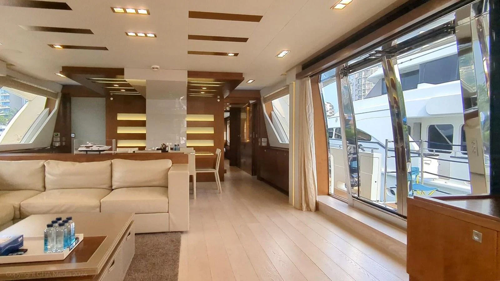 a living room with a wood floor aboard OXYGEN Yacht for Sale
