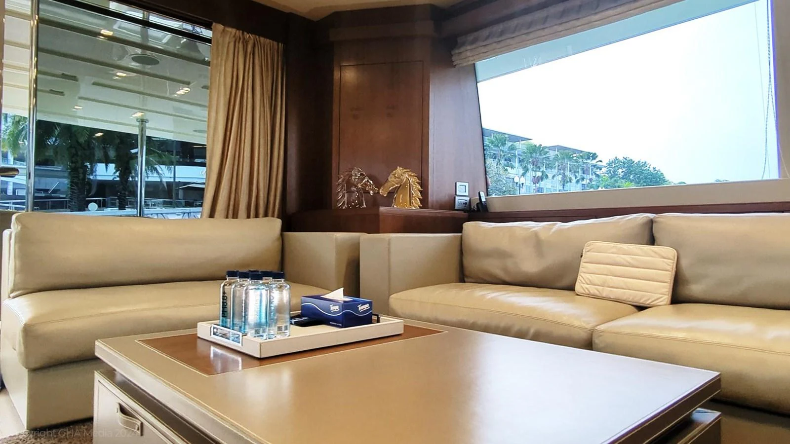 a living room with a couch and a coffee table aboard OXYGEN Yacht for Sale