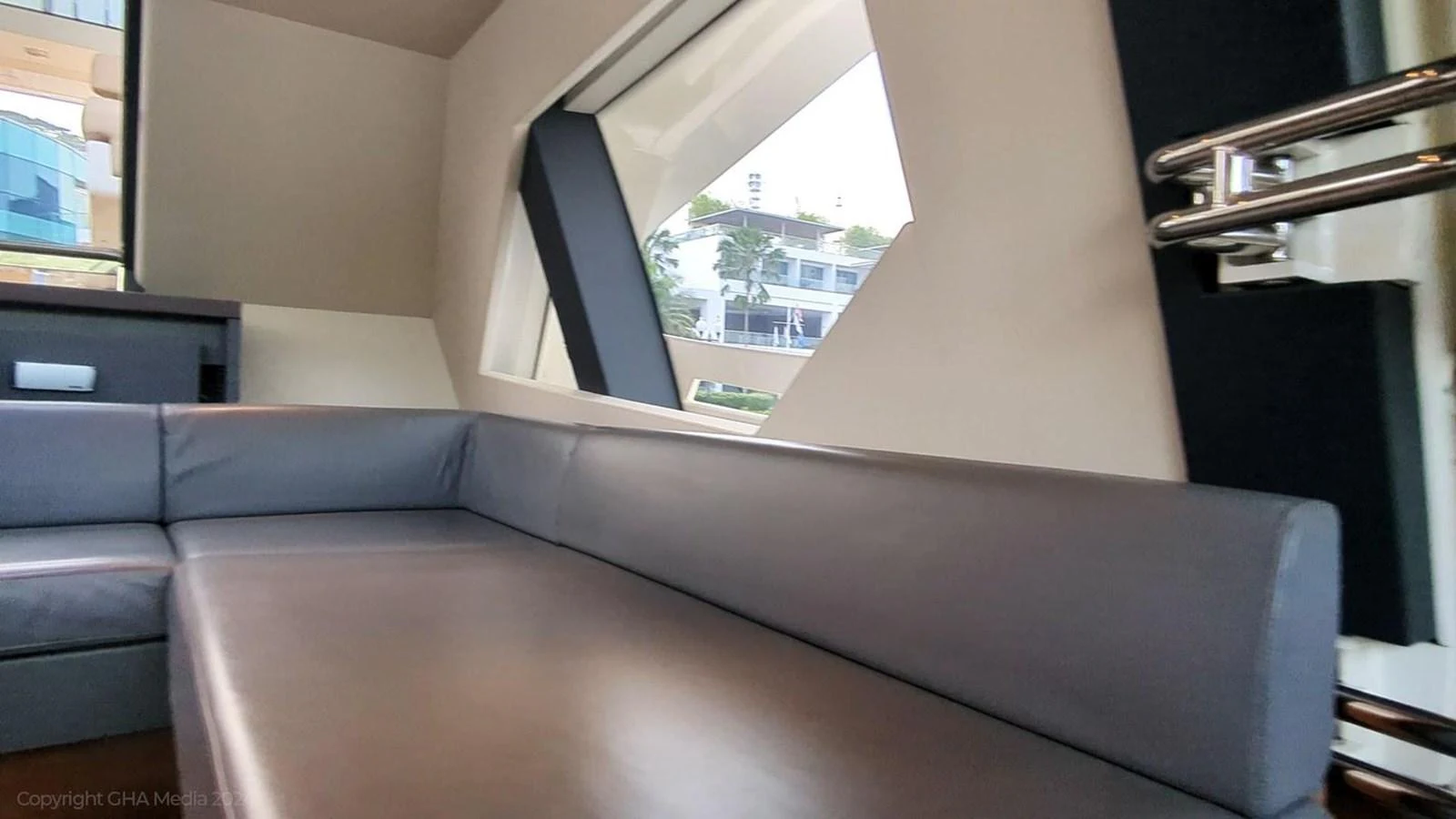 a room with a couch and a window aboard OXYGEN Yacht for Sale
