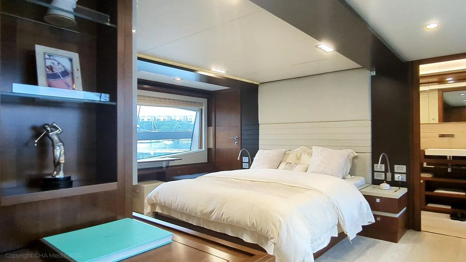 a bedroom with a bed and a sink aboard OXYGEN Yacht for Sale