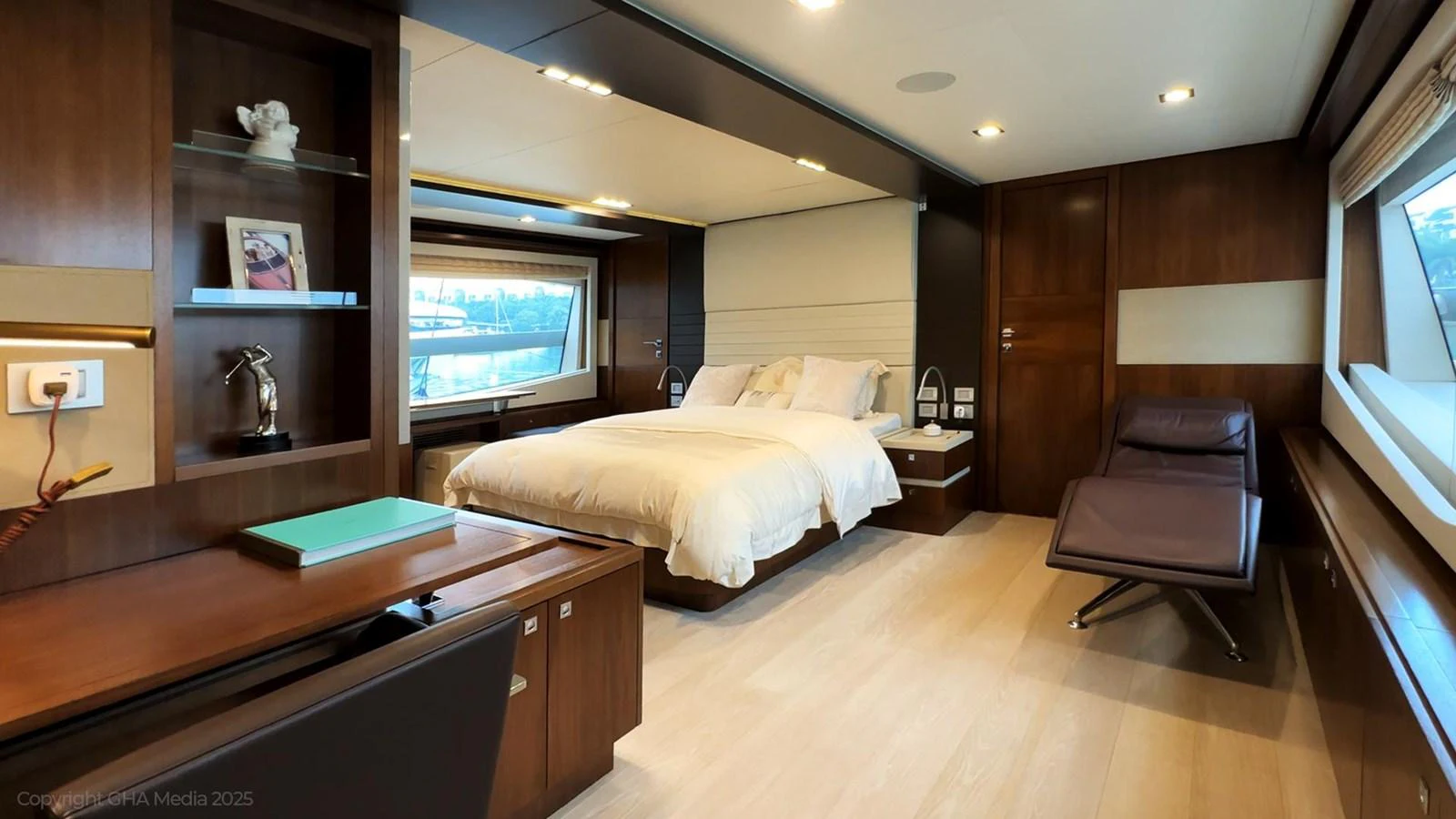 a bedroom with a bed and a desk aboard OXYGEN Yacht for Sale