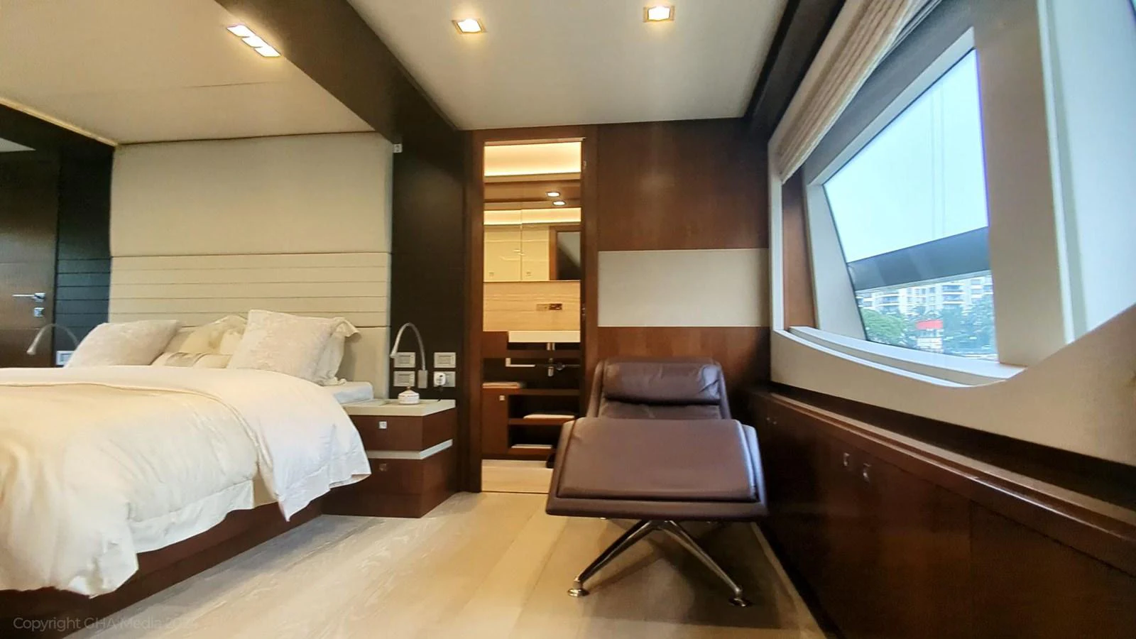 a room with a bed and a piano aboard OXYGEN Yacht for Sale