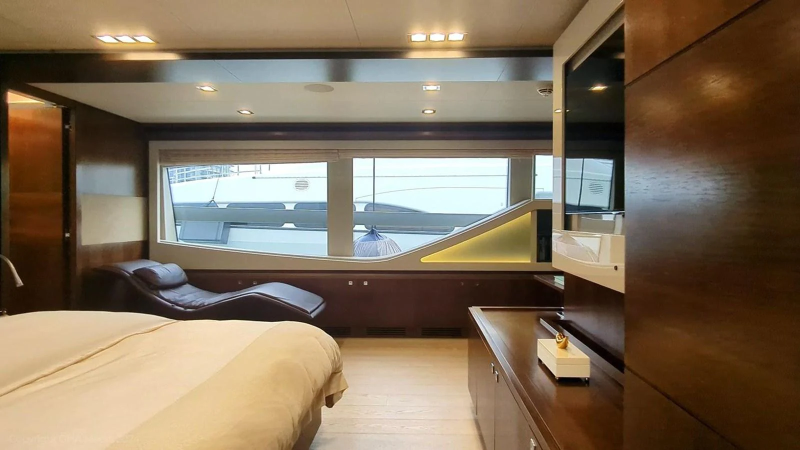 a room with a bed and a desk aboard OXYGEN Yacht for Sale