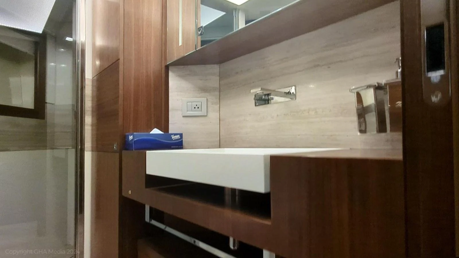 a wooden bunk bed in a room aboard OXYGEN Yacht for Sale