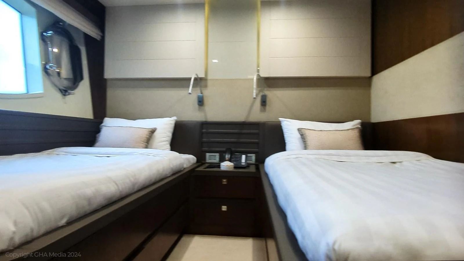 a room with two beds aboard OXYGEN Yacht for Sale