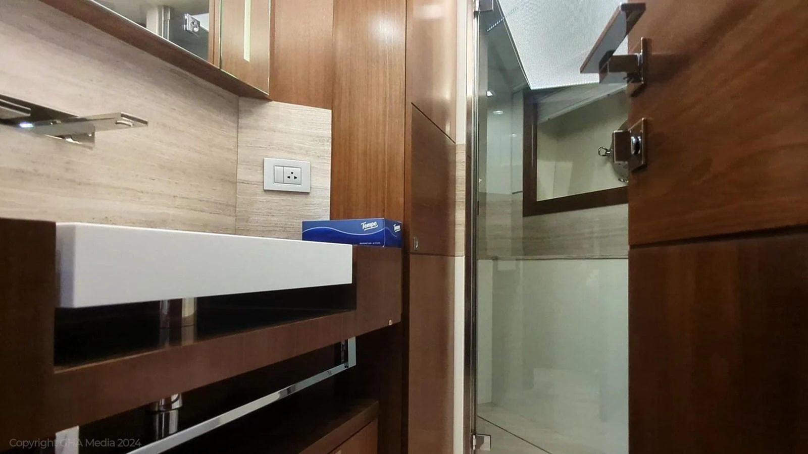 a room with wooden cabinets aboard OXYGEN Yacht for Sale