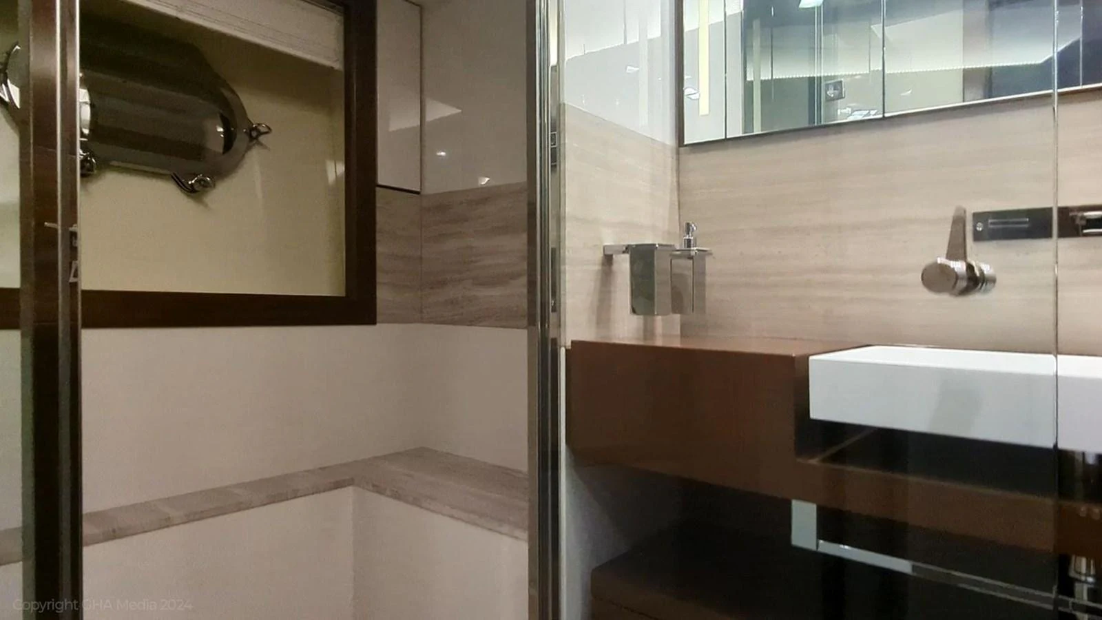 a bathroom with a glass shower aboard OXYGEN Yacht for Sale