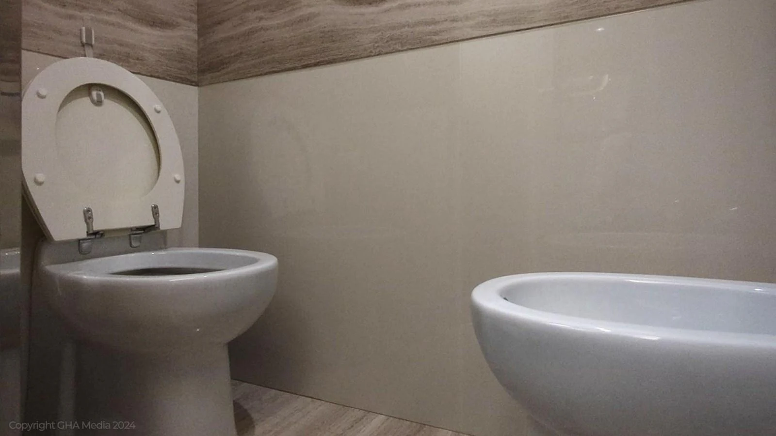 a toilet and a bathtub in a room aboard OXYGEN Yacht for Sale