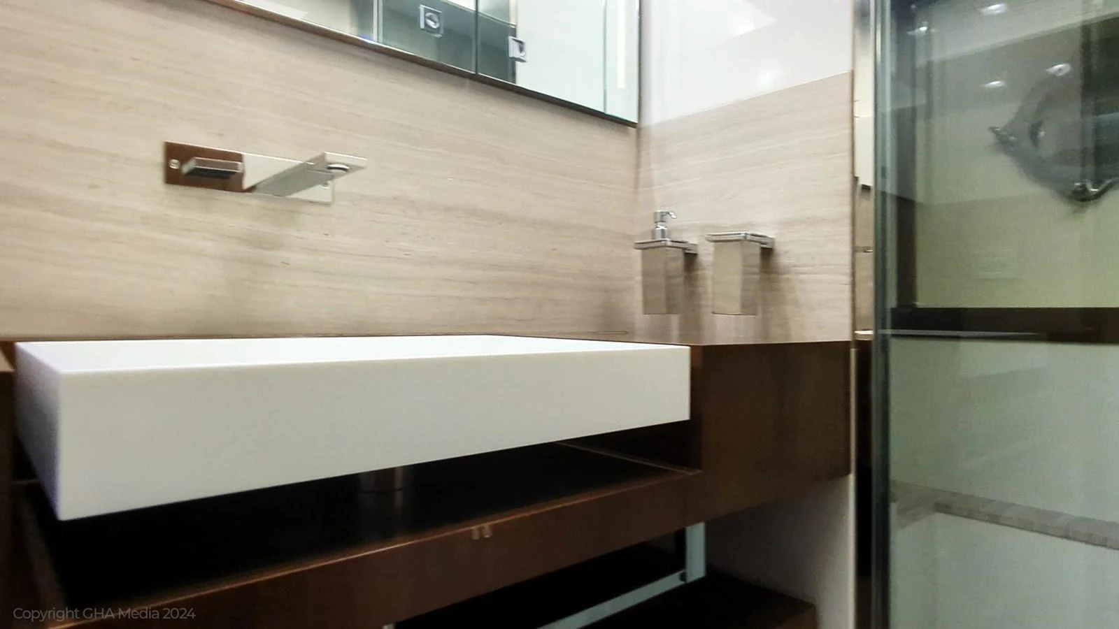 a wooden shelf with a white shelf aboard OXYGEN Yacht for Sale