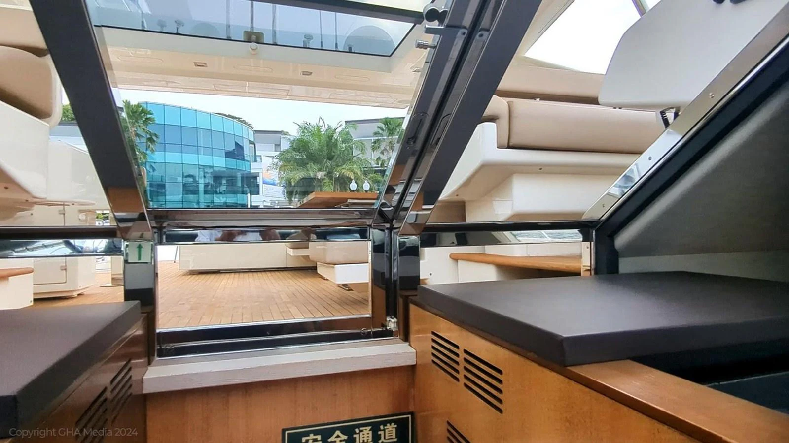a room with a large window and a desk with a computer on it aboard OXYGEN Yacht for Sale
