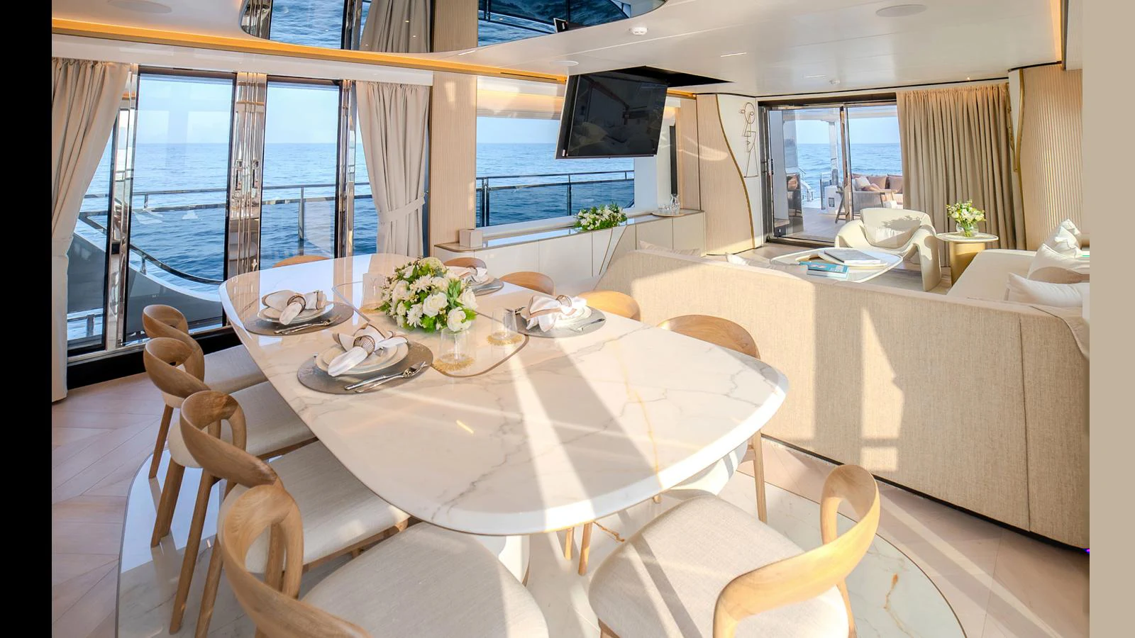 a dining table in a room aboard 100 TERRACE Yacht for Sale