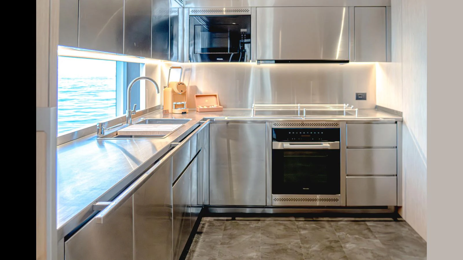 a kitchen with a sink and a window aboard 100 TERRACE Yacht for Sale