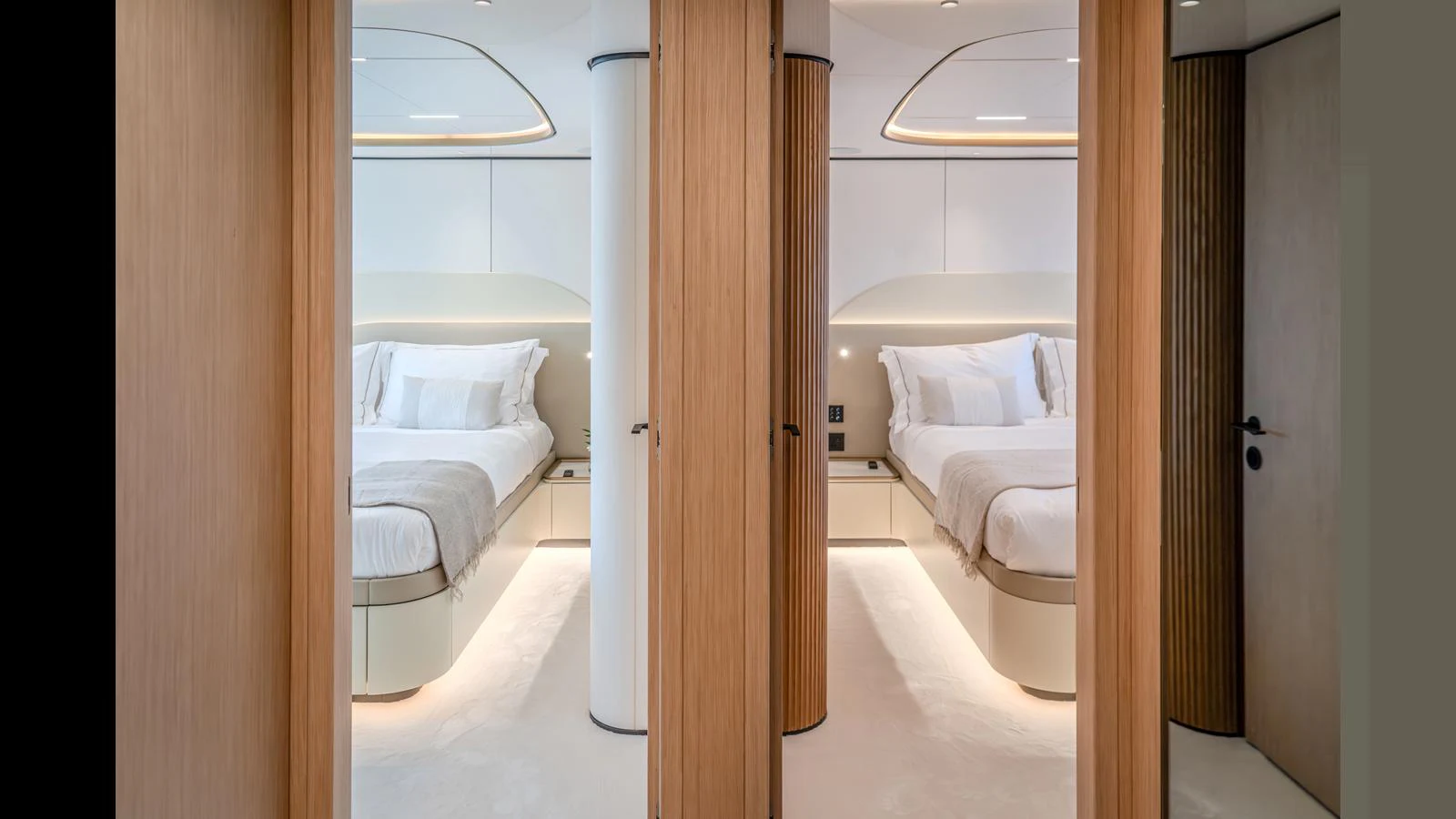 a room with a bed and a door aboard 100 TERRACE Yacht for Sale