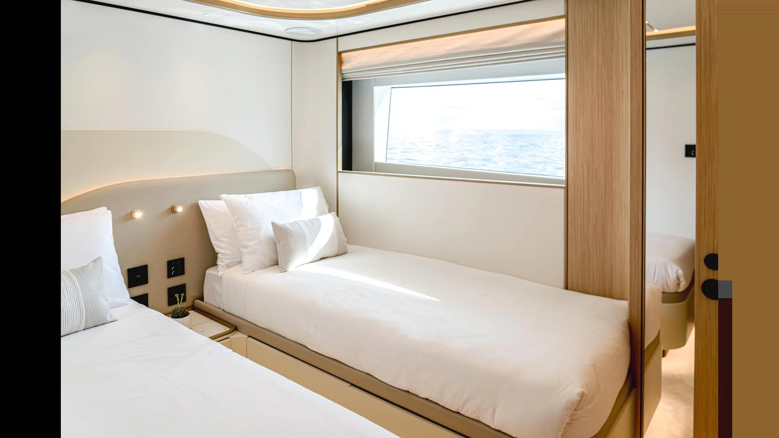 a room with two beds aboard 100 TERRACE Yacht for Sale