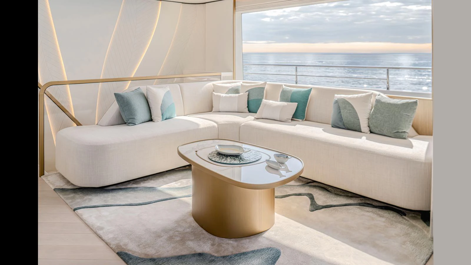 a couch with a coffee table aboard 100 TERRACE Yacht for Sale