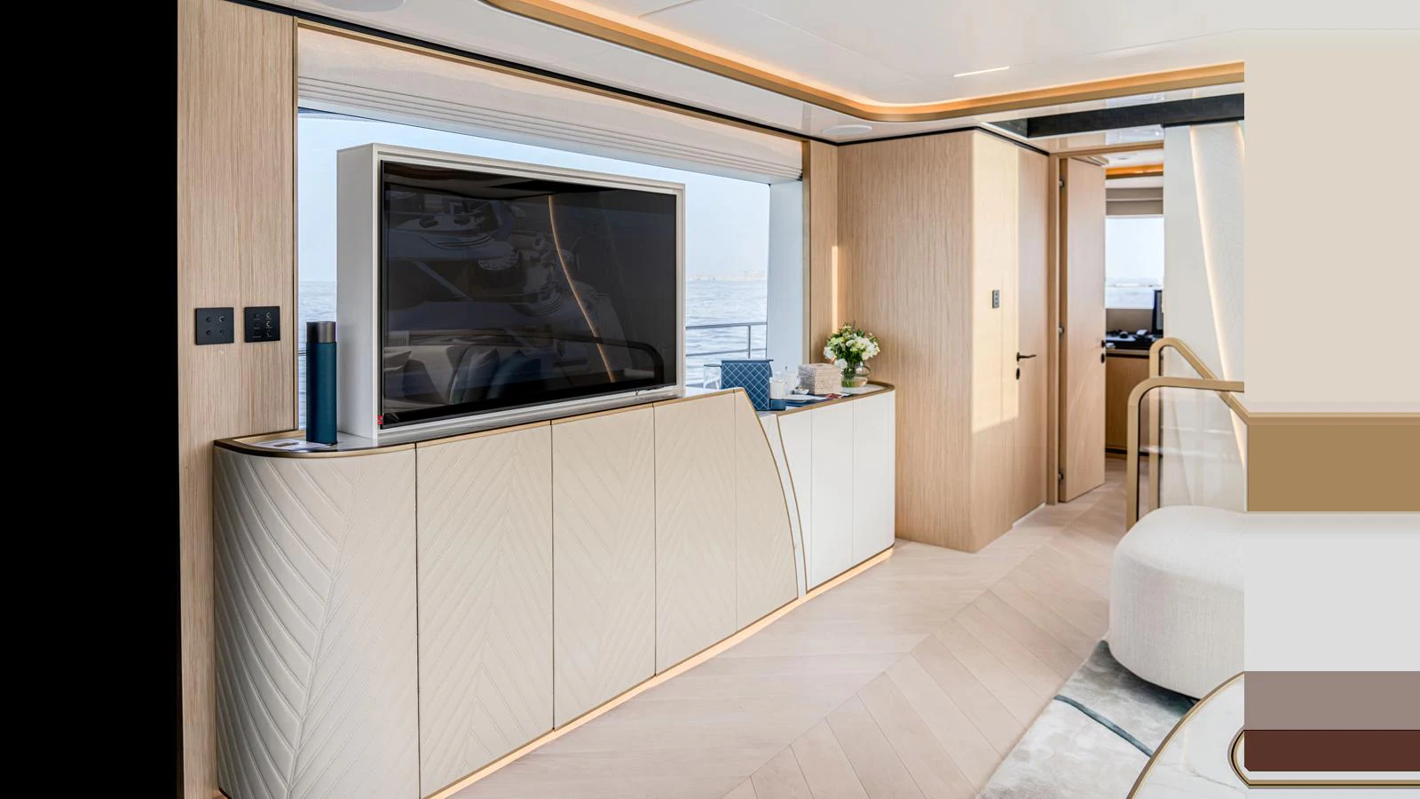 a room with a tv and a chair aboard 100 TERRACE Yacht for Sale