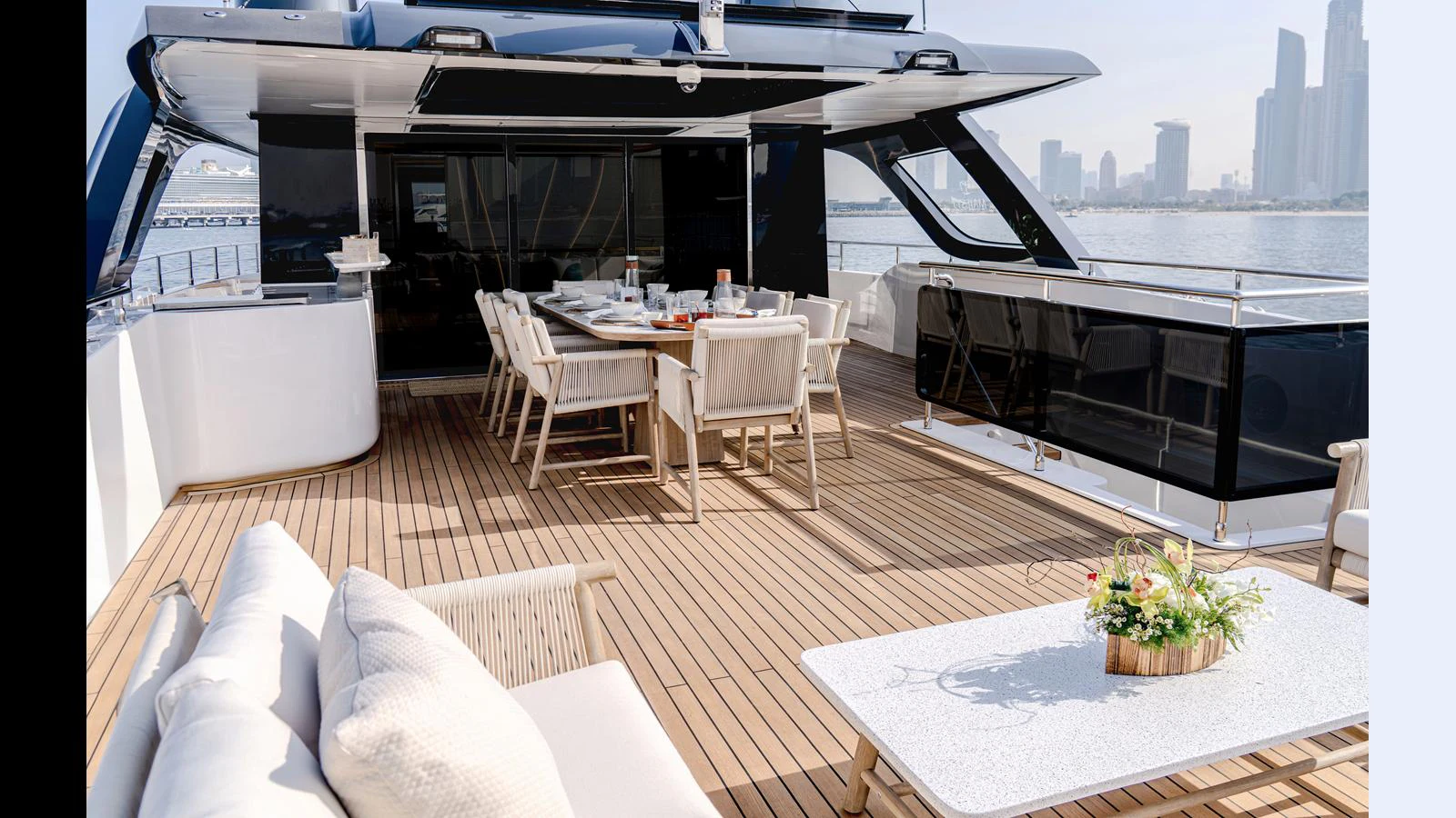 a room with a table and chairs aboard 100 TERRACE Yacht for Sale