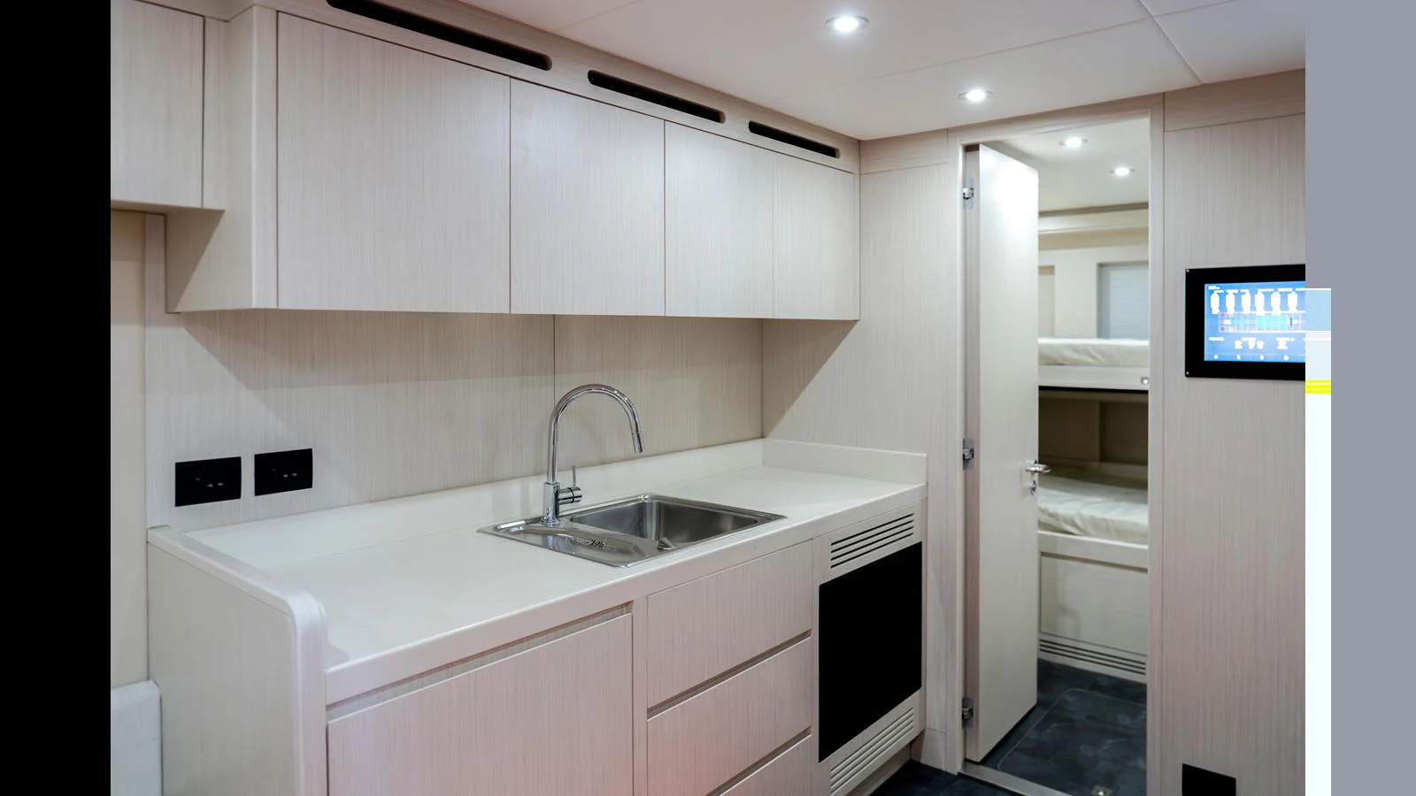 a kitchen with white cabinets aboard 100 TERRACE Yacht for Sale