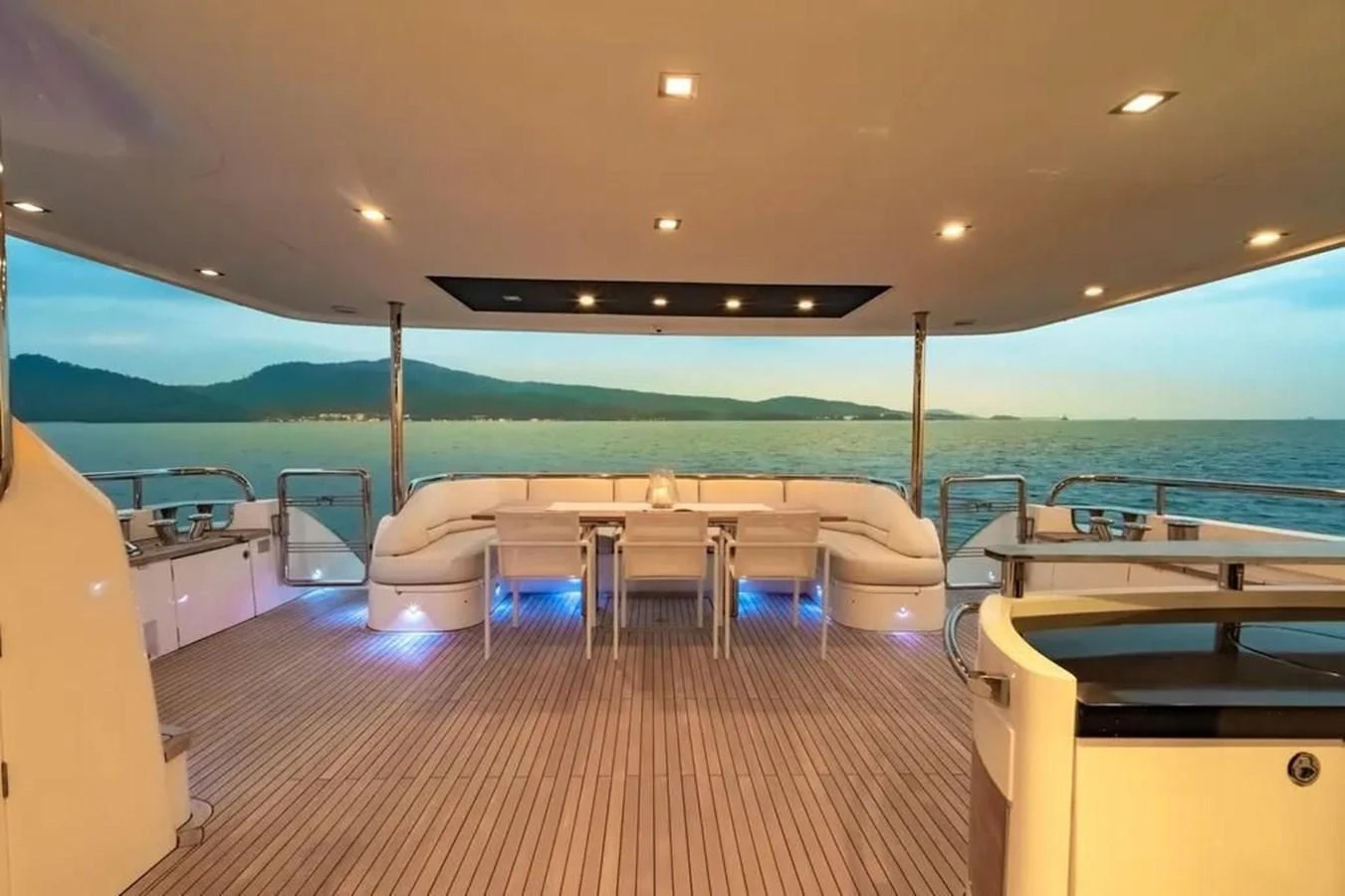 a room with a table and chairs aboard BLUE MOON Yacht for Sale