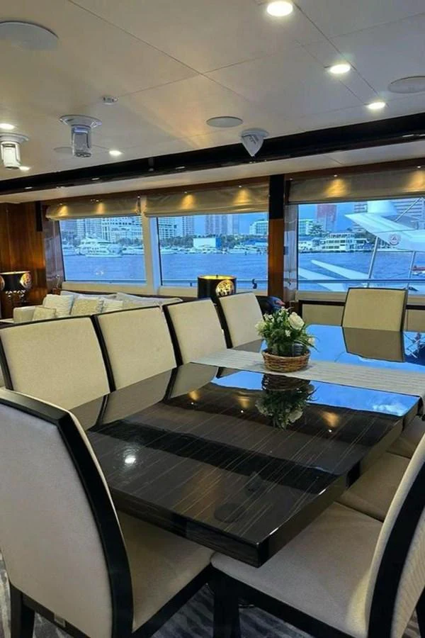 a room with a table and chairs aboard BLUE MOON Yacht for Sale