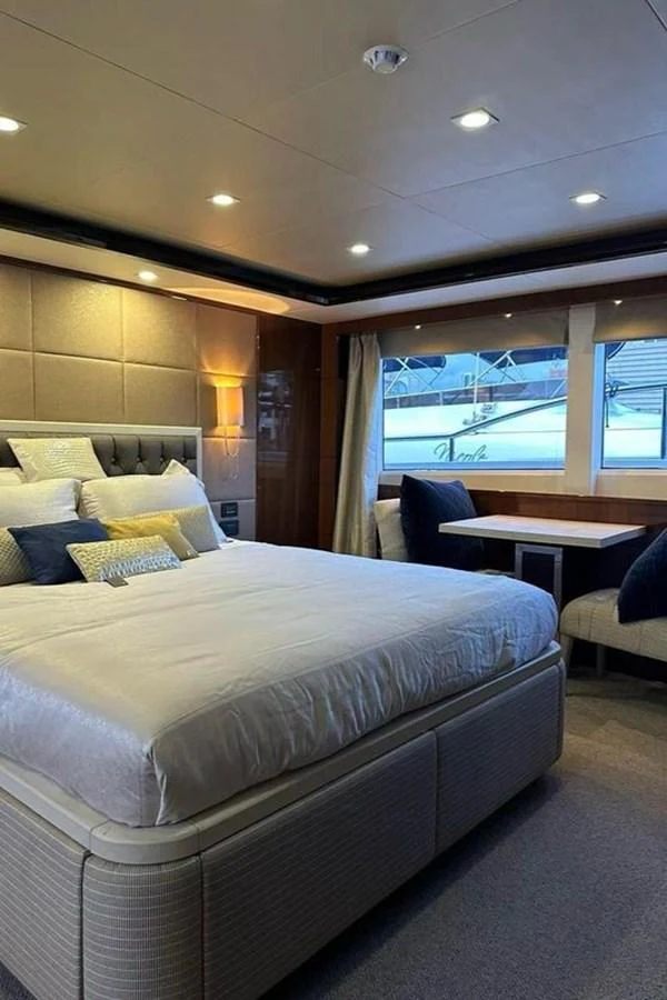 a bed with a white sheet aboard BLUE MOON Yacht for Sale