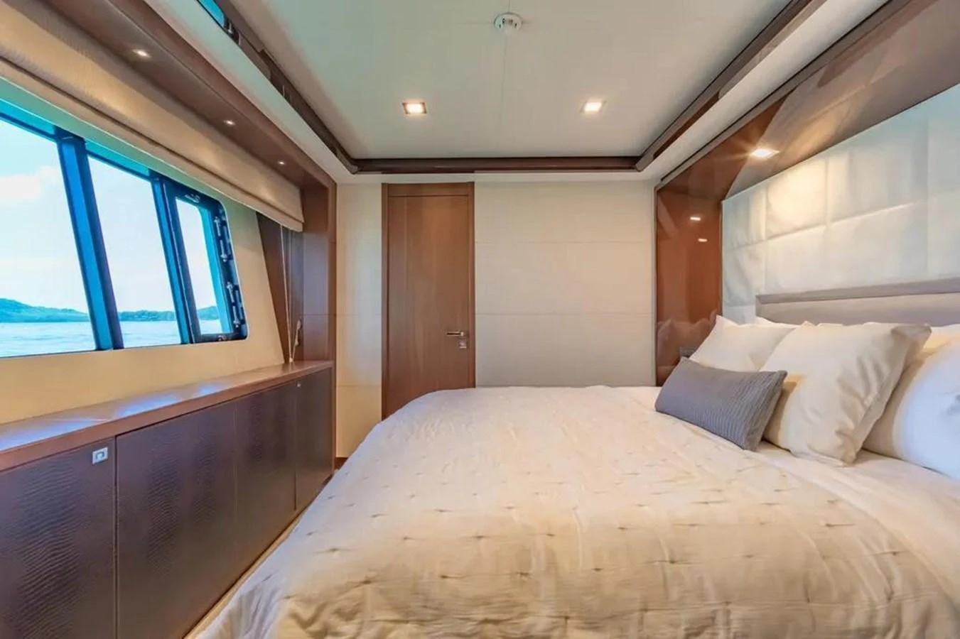 a bed with white sheets aboard BLUE MOON Yacht for Sale