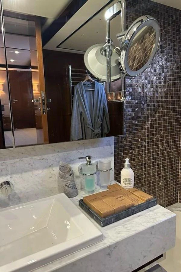 a bathroom with a large mirror aboard BLUE MOON Yacht for Sale