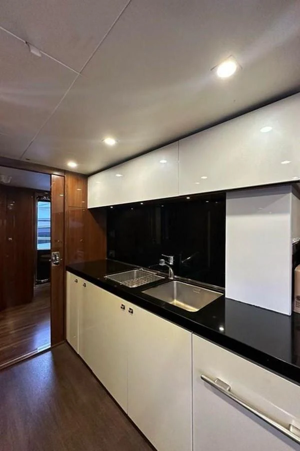 a kitchen with a sink and a mirror aboard BLUE MOON Yacht for Sale