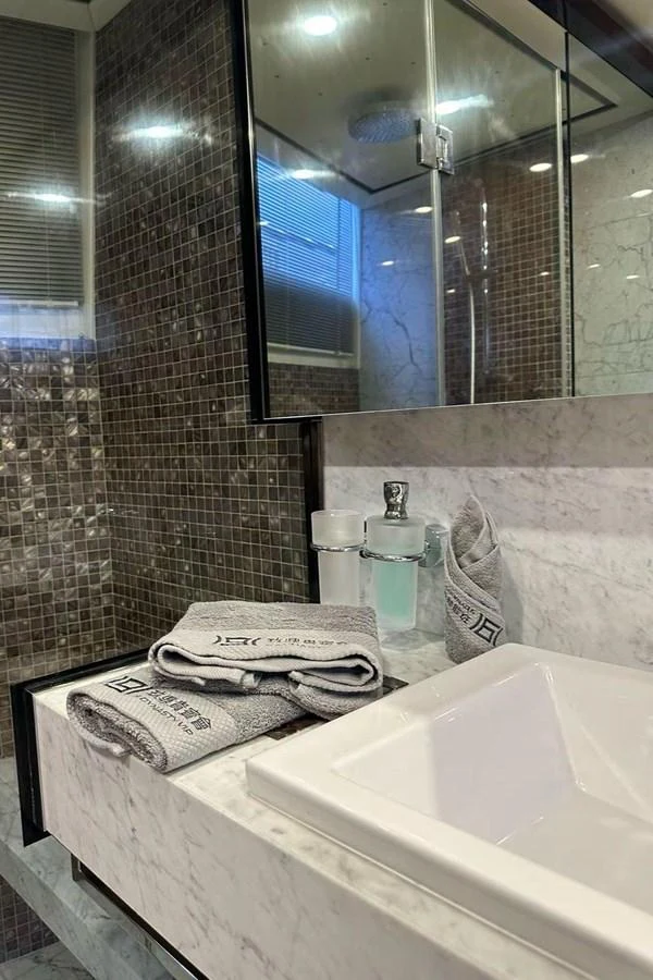 a bathroom with a large mirror aboard BLUE MOON Yacht for Sale