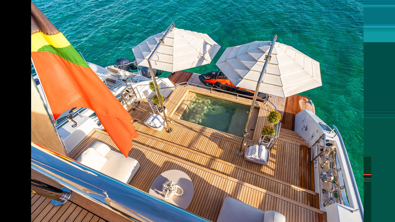 a boat with umbrellas on it aboard VIVACE Yacht for Sale