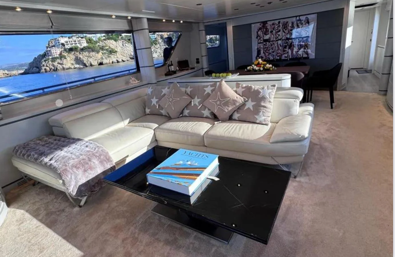 a couch with a coffee table aboard BLUE MOON Yacht for Sale