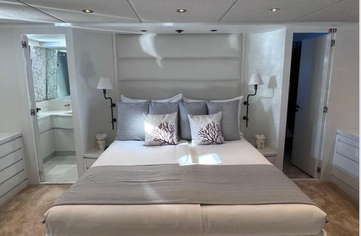 a large bed in a room aboard BLUE MOON Yacht for Sale