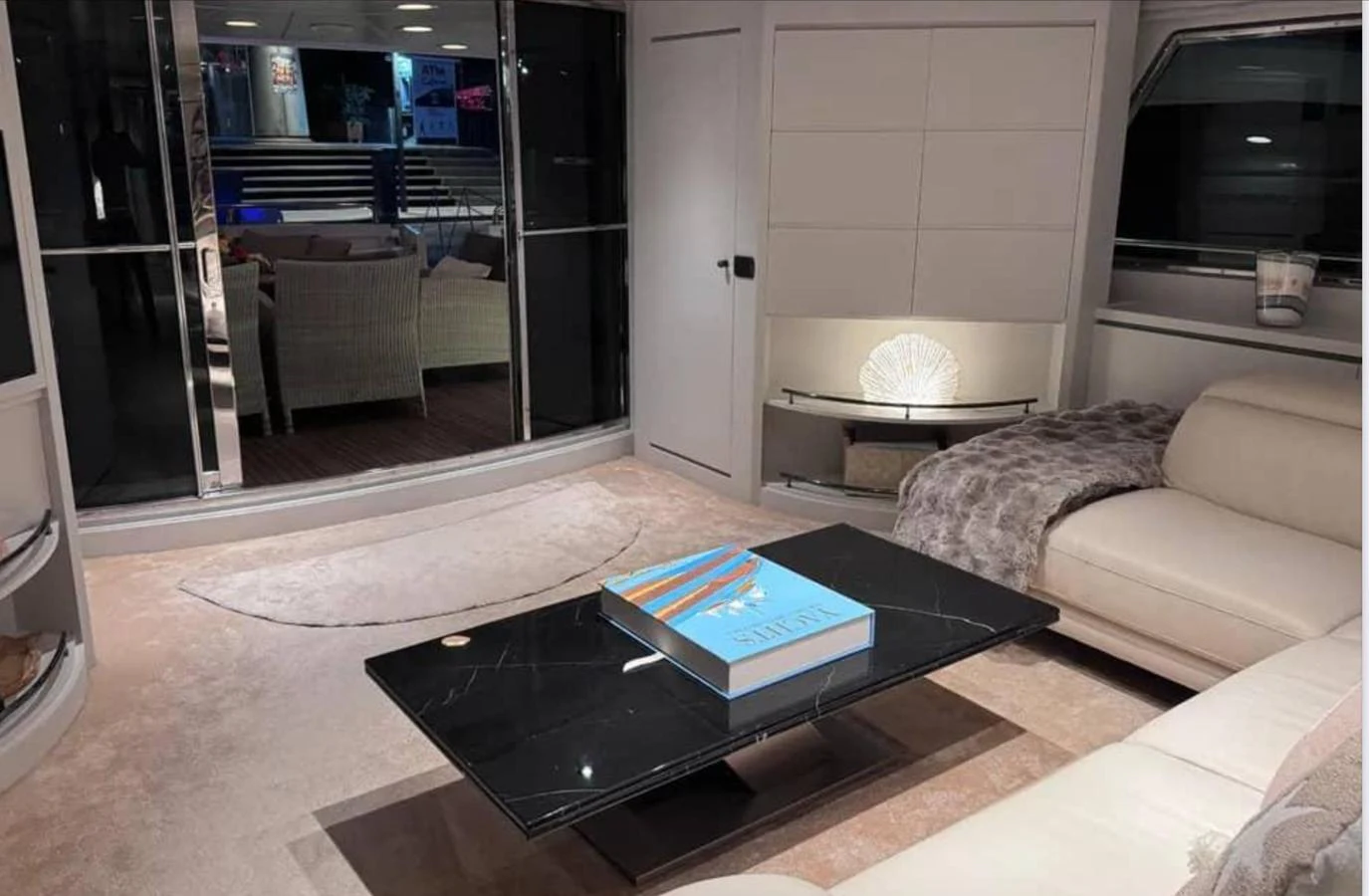 a living room with a coffee table aboard BLUE MOON Yacht for Sale