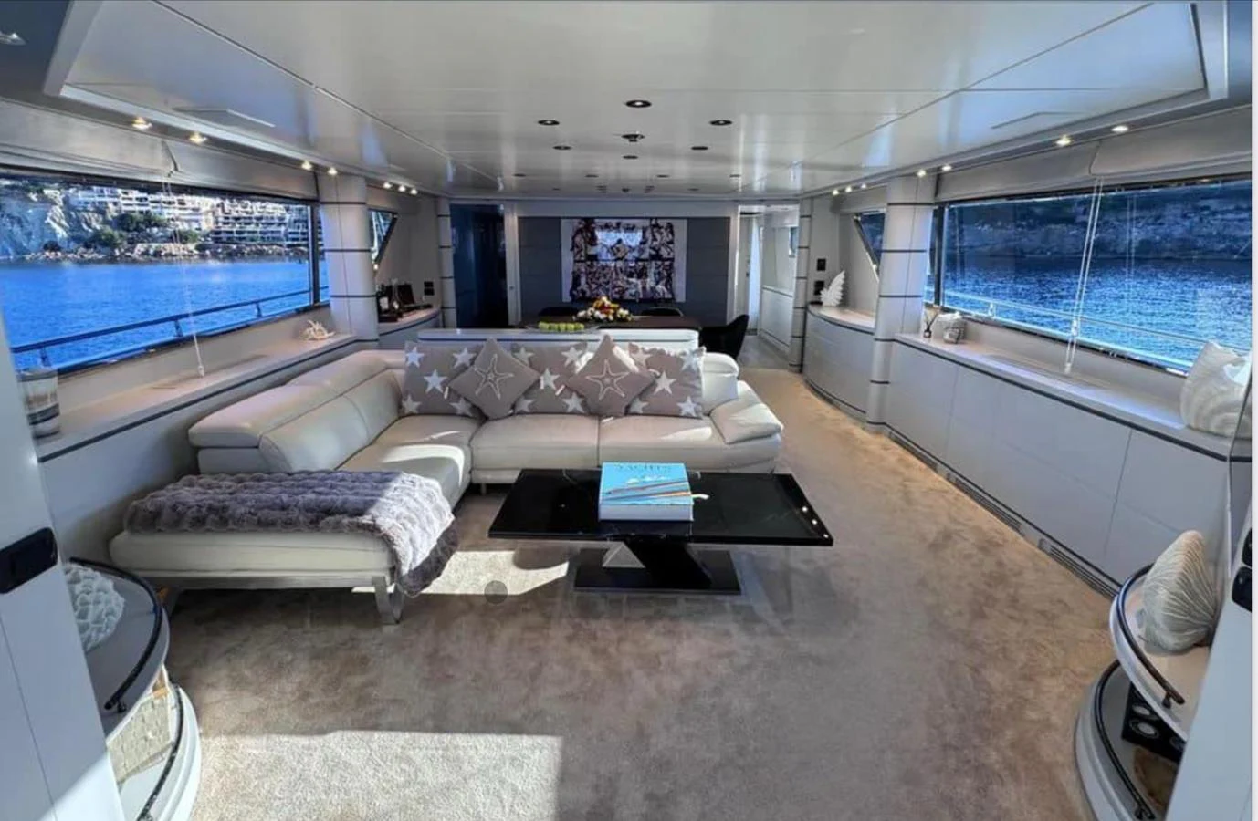 a living room with a large window aboard BLUE MOON Yacht for Sale