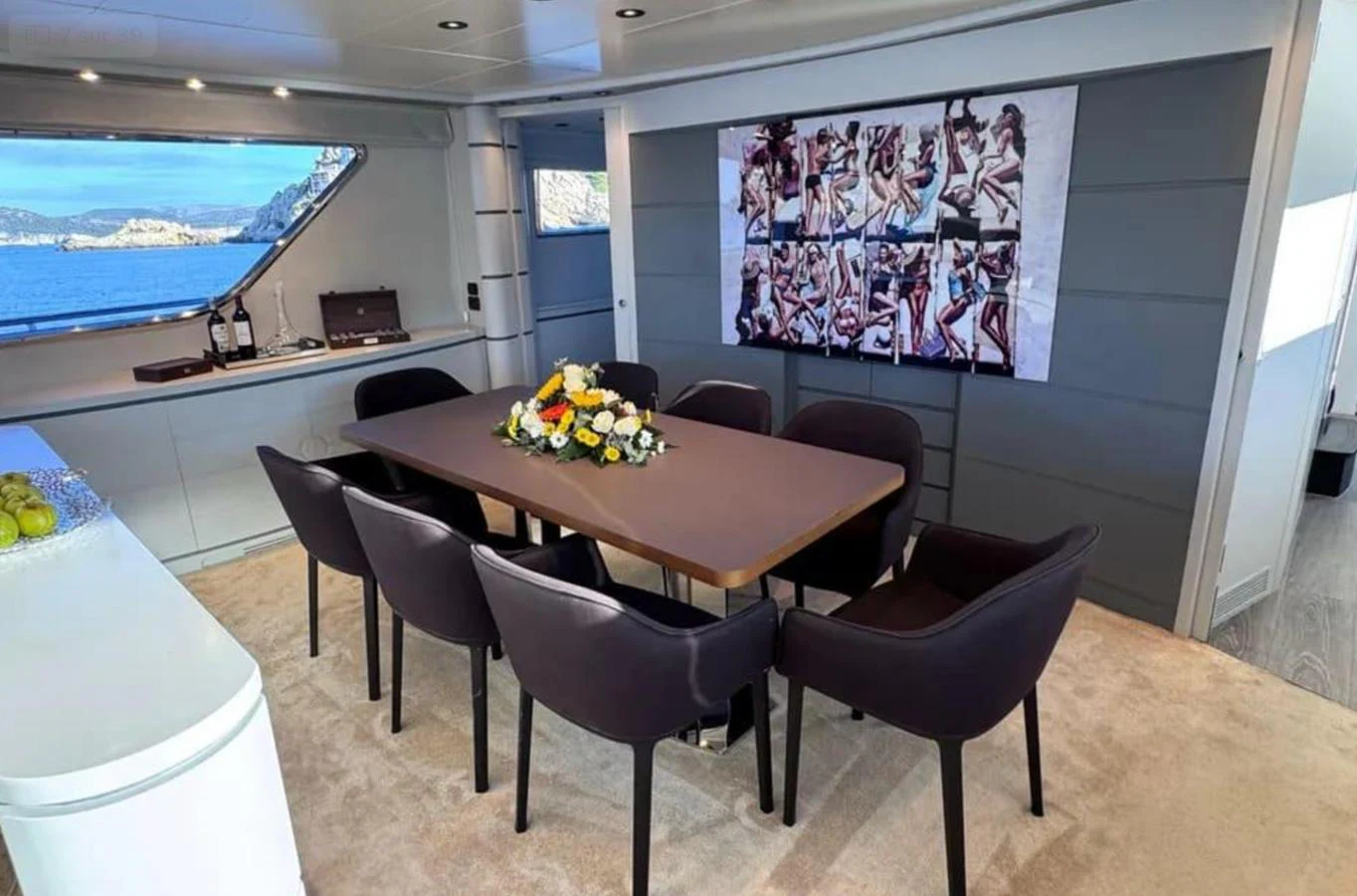 a room with a table and chairs aboard BLUE MOON Yacht for Sale