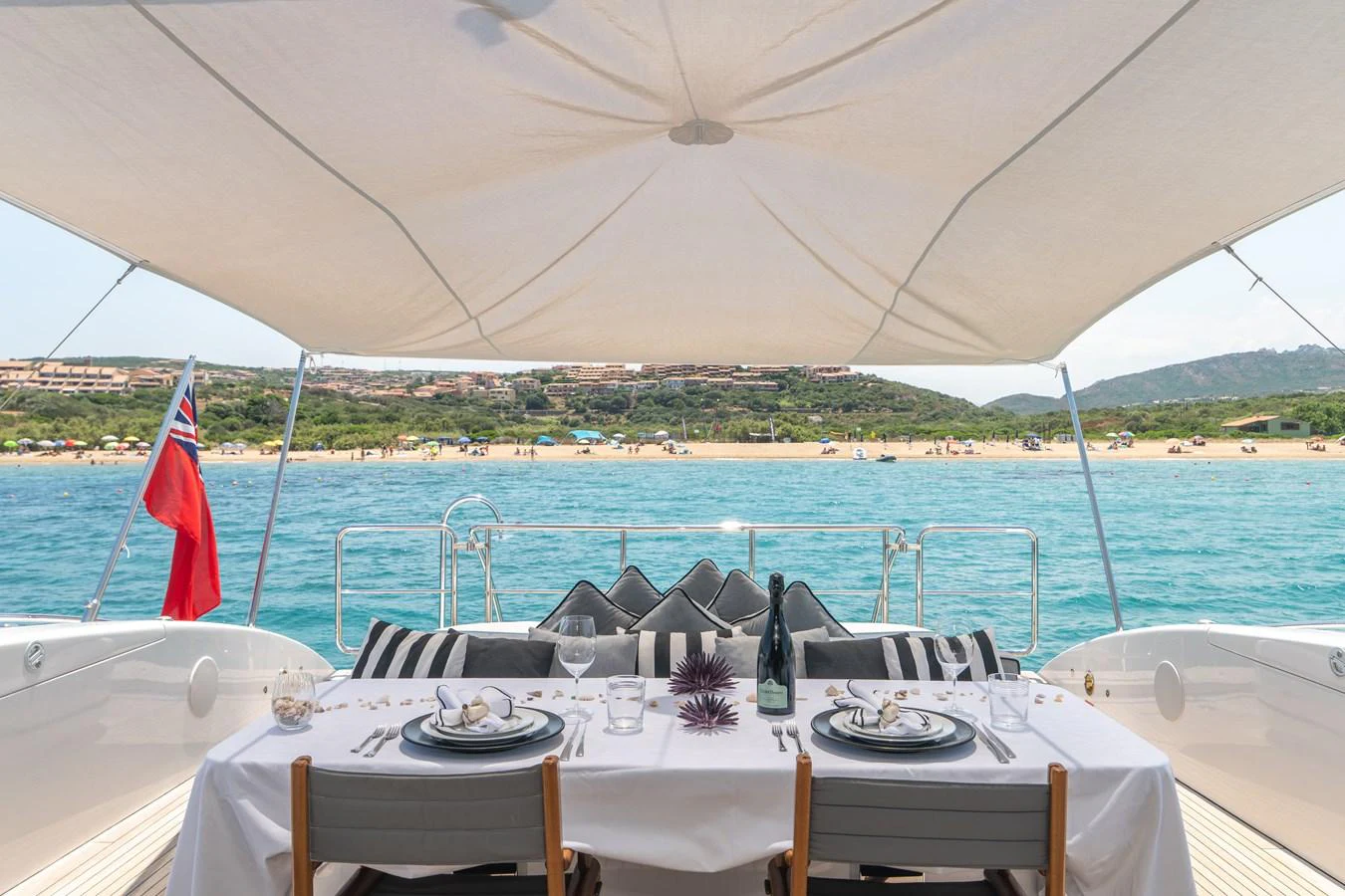 a table set for a dinner on a boat aboard KAWAI Yacht for Sale