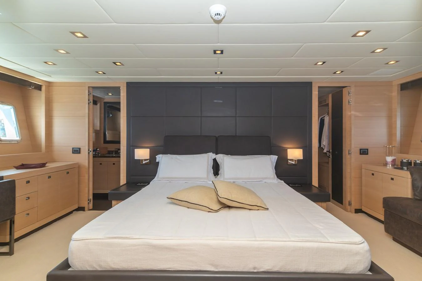 a large bed in a room aboard KAWAI Yacht for Sale
