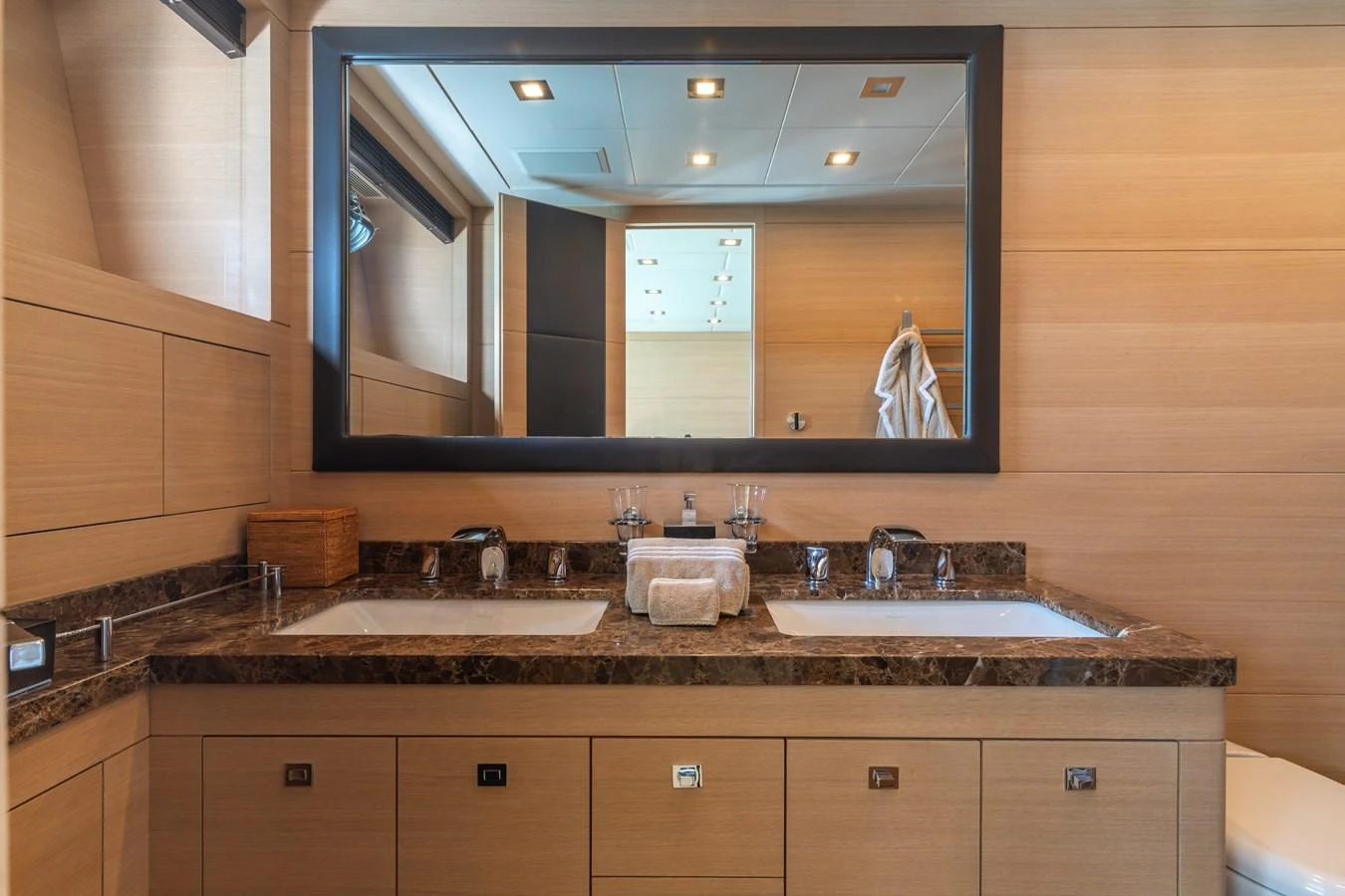a bathroom with a large mirror aboard KAWAI Yacht for Sale